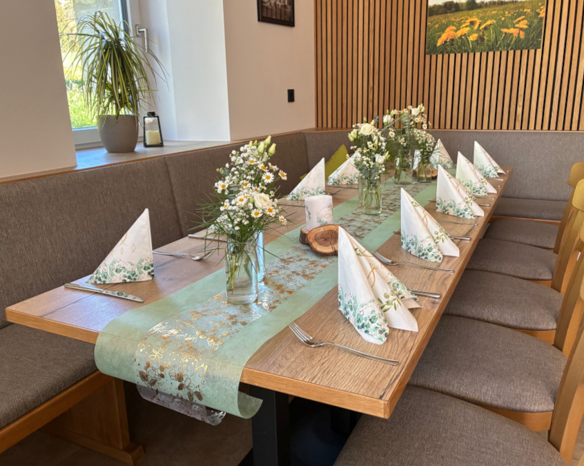 Table set with flowers and napkins for a confirmation